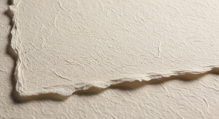 Handmade cotton paper texture with subtle fibers, soft deckle edges background