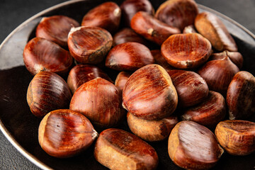 Obraz premium Edible chestnuts delicious treat tasty snack fresh gourmet food background on table rustic food top view copy space