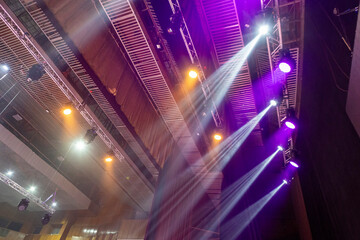 Light from stage lighting equipment in a concert hall
