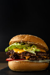 One smash burger on black background