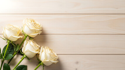 White roses arranged on wooden background in natural lighting  