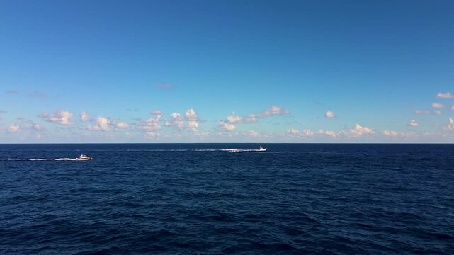 A drone video of boats in the Atlantic Ocean off the coast of Florida.