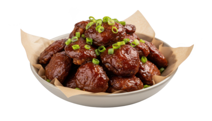 A bowl of delicious barbecue chicken wings topped with green onions isolated on transparent background