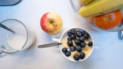 Healthy breakfast yogurt bowl with fresh fruit and milk
