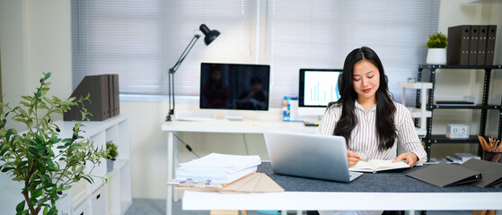 Writing, planning and computer with business woman in office, audit results and economy graph. Tax...