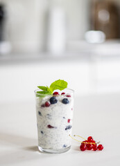 Yogurt Chia Seed Dessert With Red Currants And Blueberries