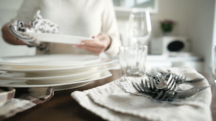 Woman Drying Clean Dishes