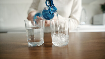 Woman Pouring Drinking Water From Bottle