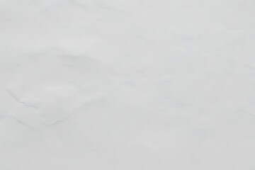 A blurry abstract image of white and gray tones with undefined shapes