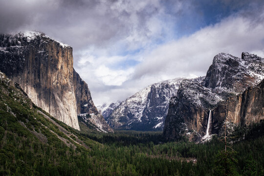 Snow-dusted granite valley with a distant waterfall - Powered by Adobe