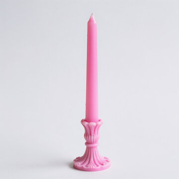 Pink taper candle isolated on white background for romantic and special occasions