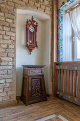 Vintage Wall Clock and Wooden Cabinet in Rustic Interior
