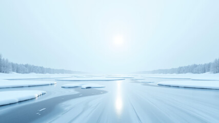Frozen lake reflecting sunlight in peaceful snowy valley at sunrise