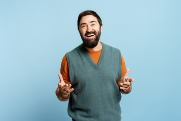 Happy man laughing and smiling, sharing a story with expressive hand gestures