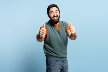 Bearded man giving double thumbs up gesture expressing approval and success