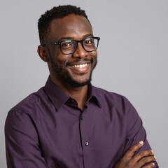 Fototapeta premium Positive, confident studio shot of a stylish African American man in eyeglasses and purple shirt. Ideal for business, fashion portfolios with modern look