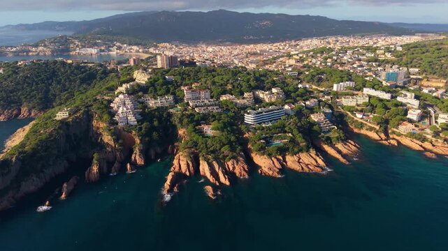 Stunning aerial perspective showing the rocky coastline and beautiful architecture of sant feliu de guixols, a charming seaside town located on the mediterranean coast of spain's costa brava
