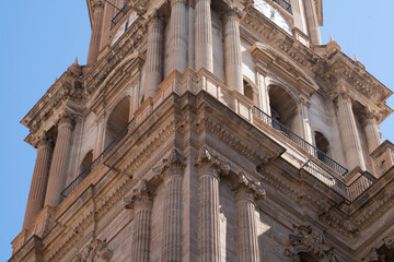 Obraz premium Architectural details of a historic cathedral tower.. Cathedral of Malaga, Spain