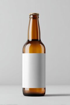 Brown glass beer bottle mockup with blank white label and golden crown cap on gray background