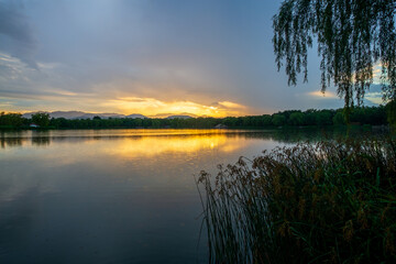 Fuhai sunset glow and reflection landscape at Yuanmingyuan, Beijing, China