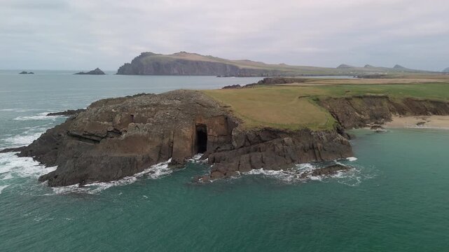 Scenic 4K aerial video of flying above spectacular Atlantic coastline, with picturesque rocks, cliffs and islands, Sybil head, Dingle Peninsula, Kerry, Ireland