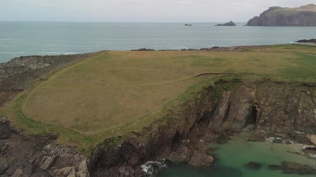 Scenic 4K aerial video of flying above spectacular Atlantic coastline, with picturesque rocks, cliffs and islands, Sybil head, Dingle Peninsula, Kerry, Ireland