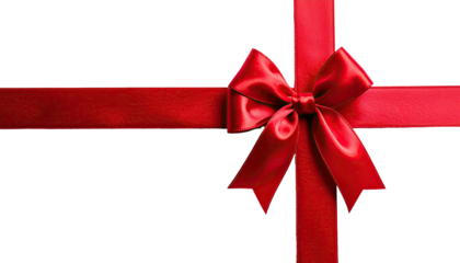 Close-up of a vibrant red satin ribbon arranged in a bow, set against a solid black backdrop