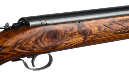 Close-up of a vintage firearm, highlighting the polished wood grain and metallic components