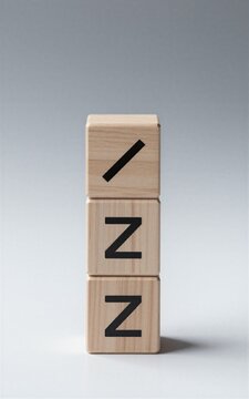 Wooden blocks spell "VCA" with checkmark, symbolizing approval or certification in minimalist design.