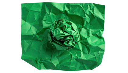 Close-up of green crumpled paper, center ball, surrounded by more wrinkled sheet
