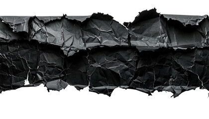 Close-up of ripped and crumpled black paper strips. Shadowed surface detail & texture revealed