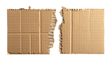 Close-up of ripped brown corrugated cardboard on a black background