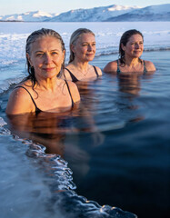 3 woman in ice water cold water swimming 