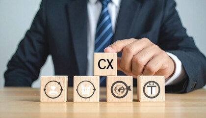 Businessman building customer experience with wooden blocks