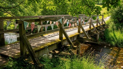 Fototapeta premium Old Wooden Bridge Over A Stream In A Lush Green Forest.