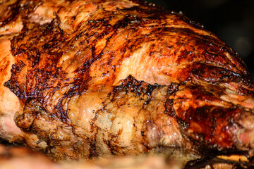 Smoked roasted whole meat detail. The Concept of Gastronomy.