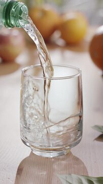 Pouring water into the glass of water. Safe drinking water is the basic condition for human health.
