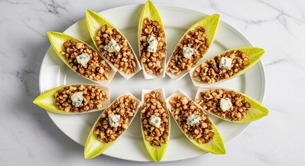 Endive Appetizers with Walnuts and Gorgonzola on White Platter.