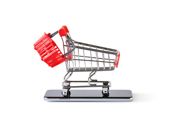 Shopping cart with basket on mobile phone - Concept of e-commerce and online shopping