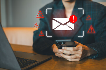 Close-up of a person checking an email alert on a smartphone, emphasizing digital communication and cybersecurity.