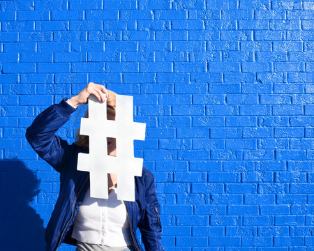 Social Media Girl Holding Hashtag Tweet