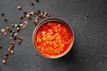 Tuna in tomato sauce canned fish seafood tasty snack fresh gourmet pescetarian diet food background...