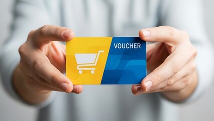 Hands holding a shopping voucher card.