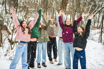 Group of young friends outdoors in a cold weather.