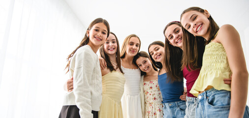 Group Of Teenage Girlfriends on studio white background