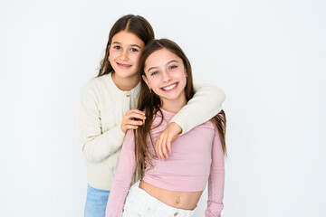 Two cute and Young pre teen girl on studio white