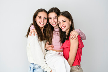 Group Of Teenage Girlfriends on studio white background