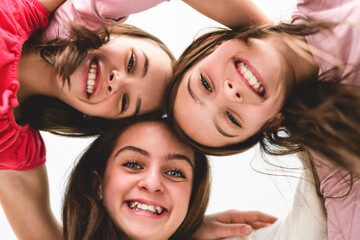 Group Of Teenage Girlfriends on studio white background