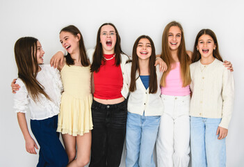 Group Of Teenage Girlfriends on studio white background