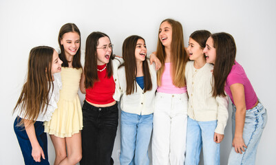 Group Of Teenage Girlfriends on studio white background